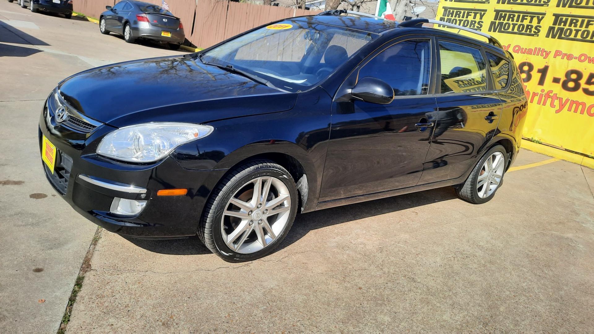 2011 Hyundai Elantra Touring (KMHDC8AE4BU) , located at 16710 Clay Rd., Houston, TX, 77084, (281) 859-7900, 29.834864, -95.656166 - Photo#1